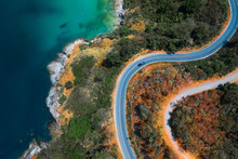 Aerial Top Down View Of The Asphalt Road On The Tropical Coastline On Phuket Island In Thailand