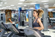 © Anatoly Repin - Young sporty Woman On Running Machine In Gym