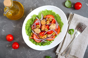 Wall Mural - Salad of marinated mussels, fresh tomatoes, red onions, olives in a white bowl. The top view