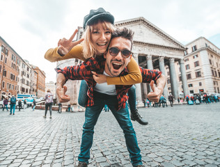 portrait of a beautiful happy couple at vacation in rome in front of pantheon amphitheatre, italy. c