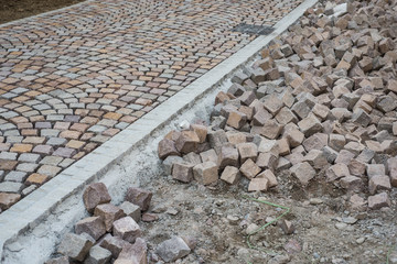 Closeup of geometric cobblestone construction site in the street