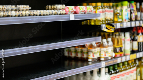 Cuadros en Lienzo Empty egg shelves in a grocery store or supermarket