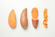 Flat lay with sweet potato on white background, top view
