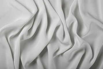 Background of white textile folded pleats