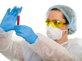 female doctor laboratory assistant examines blood on a white background for infection and coronovirus