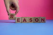 REASON word made with building blocks.