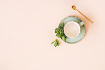 Two empty beautiful cups for coffee and tea on a light background.