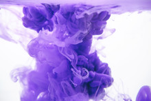 Purple Color Ink In Water On A White Background.