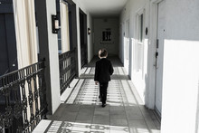 6 Year Old Boy Walking Down Corridor