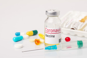 Small bottle and syringe on medicine table ready for injection vaccine for coronavirus