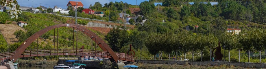 Wall Mural - Panoramic view of the trees and buildings in the city of Betanzos, Spain