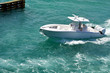 Sports fishing boat with center console powered by three outboard engines