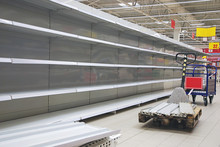 Empty Shelves And Cart In Grosery Store