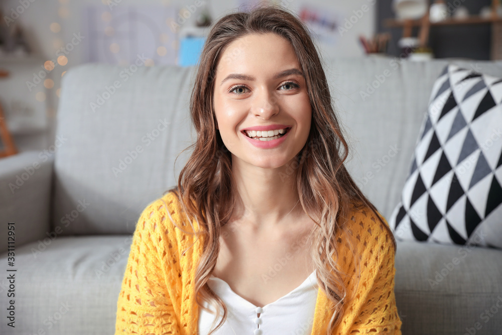 Young woman using video chat at home