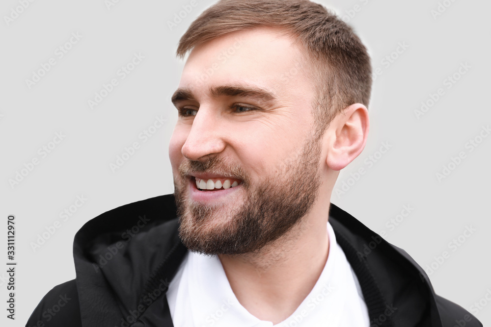 Happy smiling young man outdoors