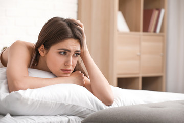 Sticker - Depressed young woman in bedroom