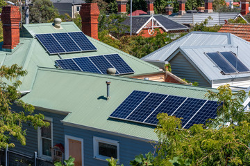 Wall Mural - Solar panels on suburban house roofs in Melbourne, Australia