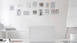 © stockbakers - Empty White Office with Open Laptop on Desk