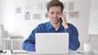 © stockbakers - Casual Adult Man Talking on Phone at Work