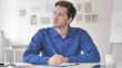 © stockbakers - Pensive Casual Adult Man Writing an Article
