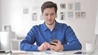© stockbakers - Casual Adult Man Using Smartphone, Typing Message