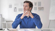 © stockbakers - Relaxing Casual Man Drinking Coffee at Work