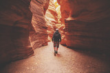 Fototapeta  - A man walking in canyon back to the camera. Red canyon, Eilat, Israel