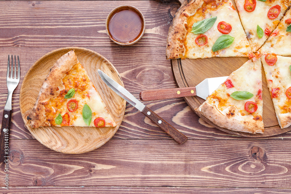 Composition with delicious pizza Margherita on wooden background