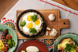 Fototapeta Kuchnia - Fried egg with green spinach in pan, healthy breakfast. Healthy food.