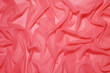 Draped with waves lightweight semitransparent fabric coral color
