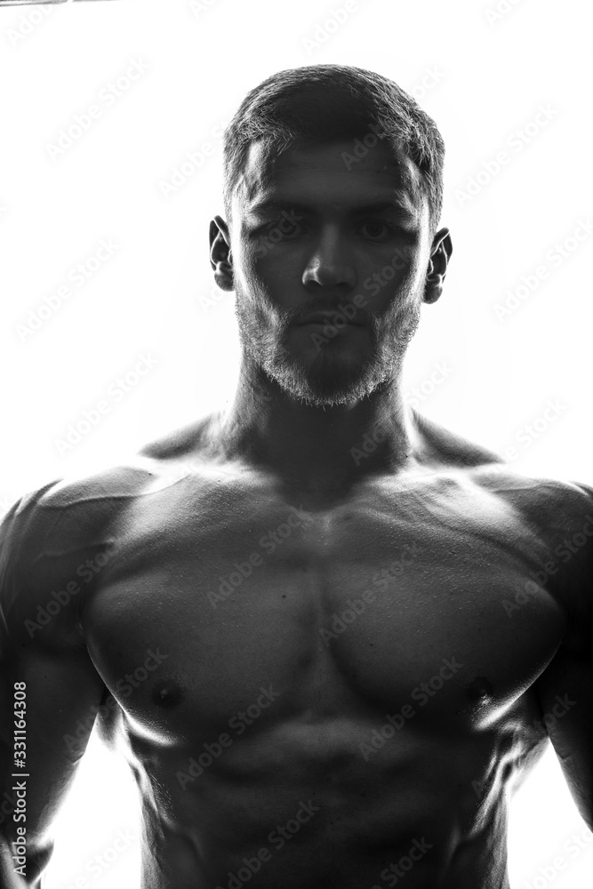 Silhouette of a bodybuilder - obrazy, fototapety, plakaty 