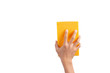 Hand holding yellow sponge isolated on white background