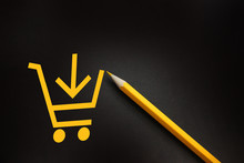 Yellow Pencil With Shopping Cart On Black Background In Buying Shopping Ecommerce Concept