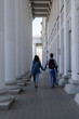 © Majid Gheidarlou - Young couple walking through columns and taking each other hands
