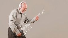 Excited Senior Playing Imaginary Guitar