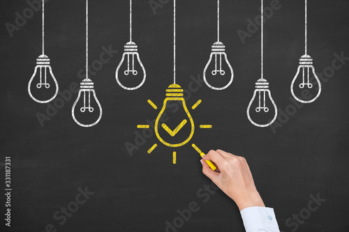 Creative idea concepts with light bulbs on a chalkboard background
