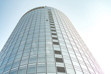 underside panoramic and perspective view to steel blue glass high rise building skyscrapers, business concept of successful industrial architecture