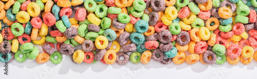 Cuadros en Lienzo top view of bright multicolored breakfast cereal on white background, panoramic