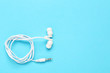 © 5second - White earphones on blue background