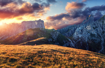 Fototapete - Wonderful Alpine Highlands during sunset. Amazing nature landscape of Dolomites Alps. Dramatic scene with colorful sky. A magnificent panorama of the mountains under sunlight. Greative image