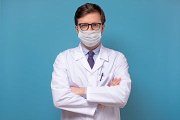 Physician or doctor posing with a face mask