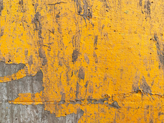 Peeling paint on wall seamless texture. Pattern of rustic Yellow grunge material.