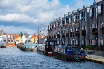 Boats moored in a canal in New Islington newly developed area in Manchester