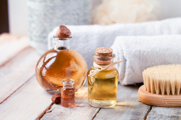 Concept of using natural oil in cosmetology. Moisturizing skin care and aromatherapy. Gentle body treatment with a brush. Atmosphere of harmony, relax and pleasure. Luxury lifestyle 