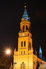 Wall Mural - belfry of neo-Gothic brick Catholic church at night in Poznan.