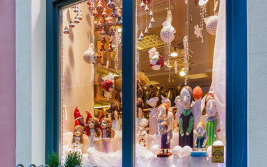 Angel statues in shop window in Christmas Riga