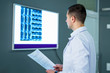 © Vadim - Doctor looking at x-ray in a hospital. Medical and health care concept.