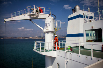 Poster - A large tanker kargo ship is being renovated and painted in shipyard dry dock.