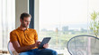 © marvent - Young man working on a tablet in his modern apartment