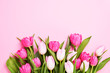 Bouquet of pink tulips on pink background. Beautiful greeting card. Holidays concept. Copy space, top view